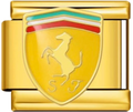 CHARM MARCA FERRARI DORADO